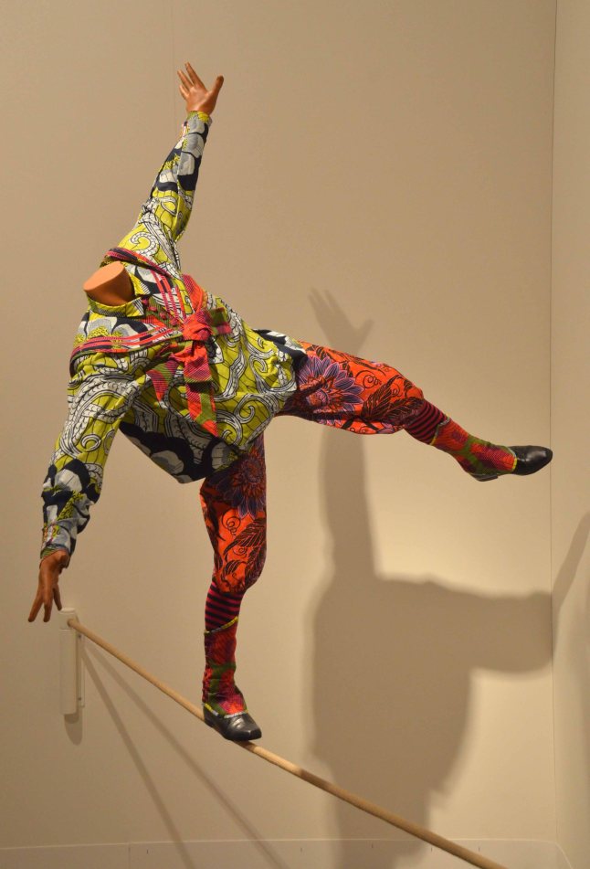 Yinka Shonibare, MBE, "Boy on Tightrope", 2012, Mannequin, Dutch wax on printed cotton, fiberglass, leather and rope, Gallery: James Cohan Gallery